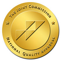 circle logo in gold with text the joint commission national quality approval